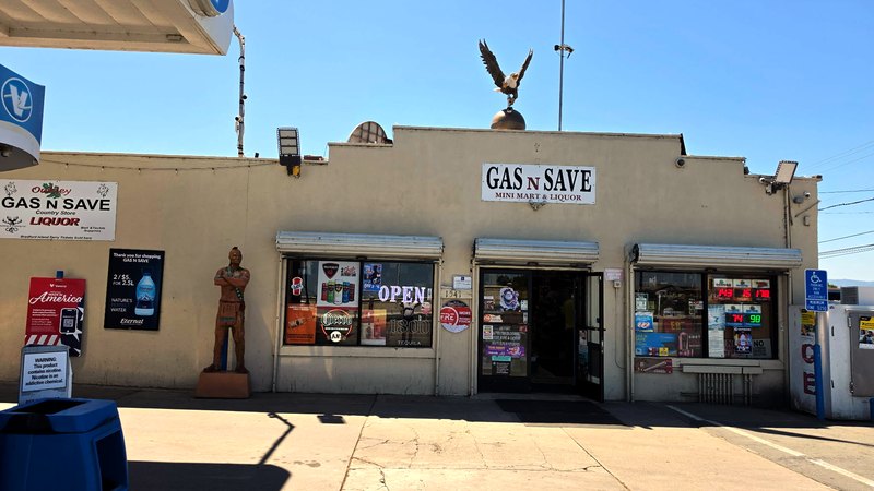 The Gas N Save country store, with the Bradford Island ferry ticket sign by the door