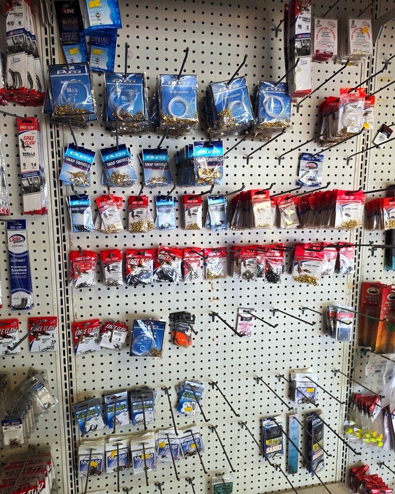 Packaged soft-plastic lures hanging on the tackle wall